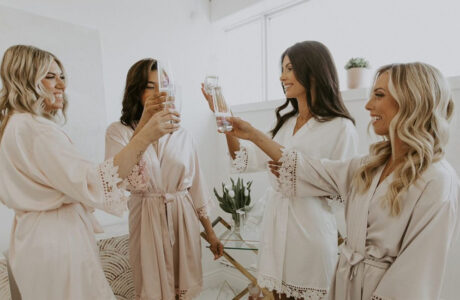 Parla Hair Blog - 3 Stress Free Wedding Day Morning Tips - Bride and Bridesmaids Clinking Glasses of Champagne